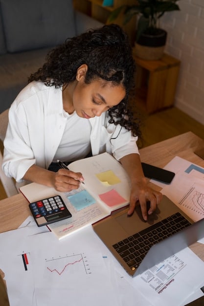 A person reviewing a detailed budget spreadsheet on their laptop, highlighting key spending categories and savings goals, emphasizing the importance of financial monitoring.
