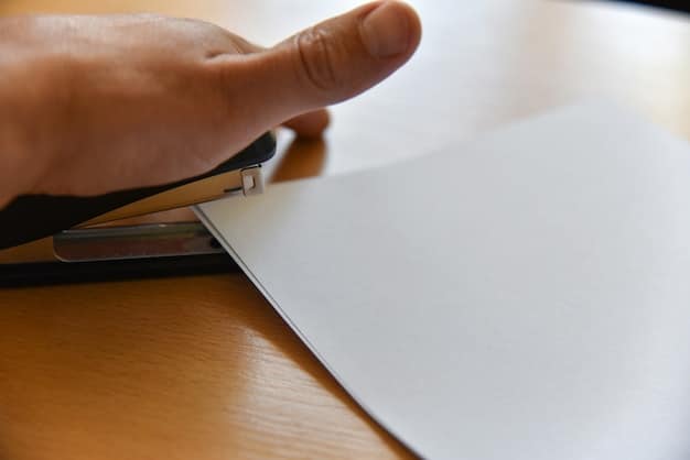 A close-up of a FAFSA form being filled out, with a hand holding a pen and highlighting a specific section. Financial aid documents are visible in the background, suggesting a focus on Pell Grant application details.