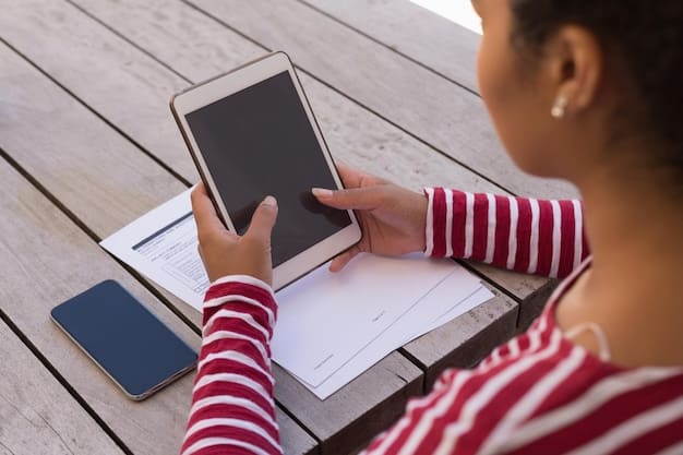 A student working on a digital tablet, researching information for a school project. The focus is on their hands and the tablet screen, showing various educational apps and search results.