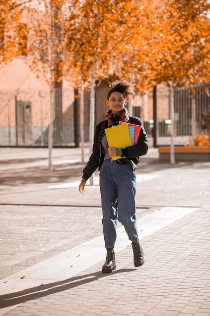 A student happily walking across a community college campus, holding textbooks and smiling confidently. The scene is bright and optimistic, portraying the potential for success in affordable education.