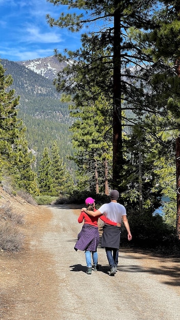 A family using their National Park Pass to enter a campsite with a scenic view in Yosemite National Park.