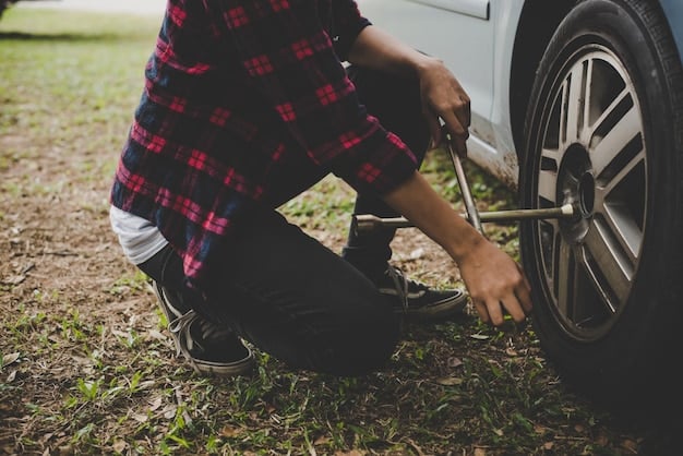 A close-up of someone checking the tire pressure of an RV, emphasizing the importance of pre-trip maintenance.