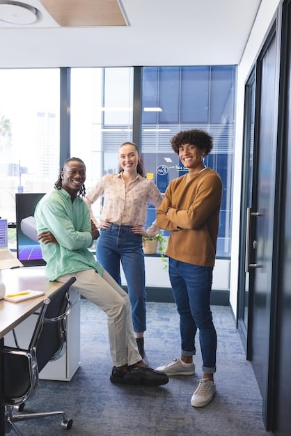 A group of diverse professionals in a modern office setting, engaged in a lively and inclusive discussion. They are actively listening to each other, nodding in agreement, and using open body language to show respect and understanding.