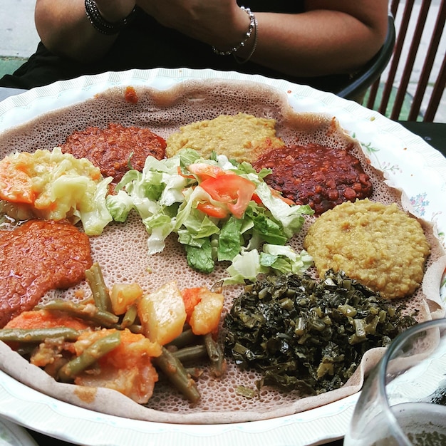 A close-up shot of a delicious and affordable meal from a local ethnic eatery, such as a taco stand, a pho restaurant, or a food truck. The photo should highlight the quality and affordability of the food.