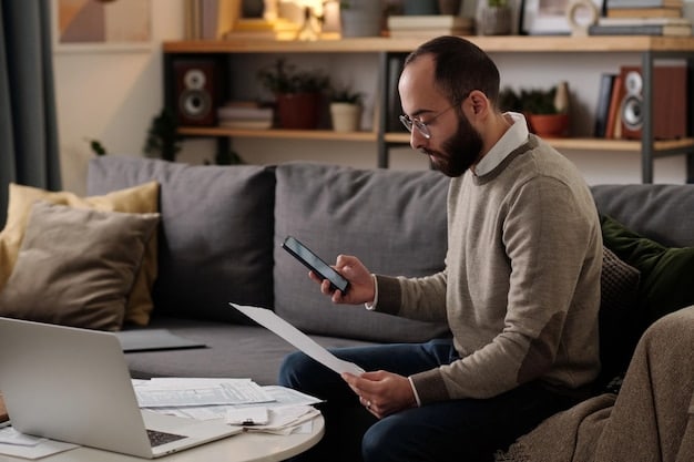 A person using a budgeting app on their phone, with charts and graphs showing income and expenses. The background is a cozy home office setup.