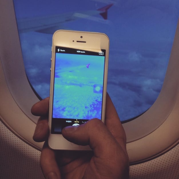 A close-up of a smartphone screen displaying a flight search engine with filters set to 